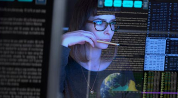 AI student looking at lines of code on a computer screen