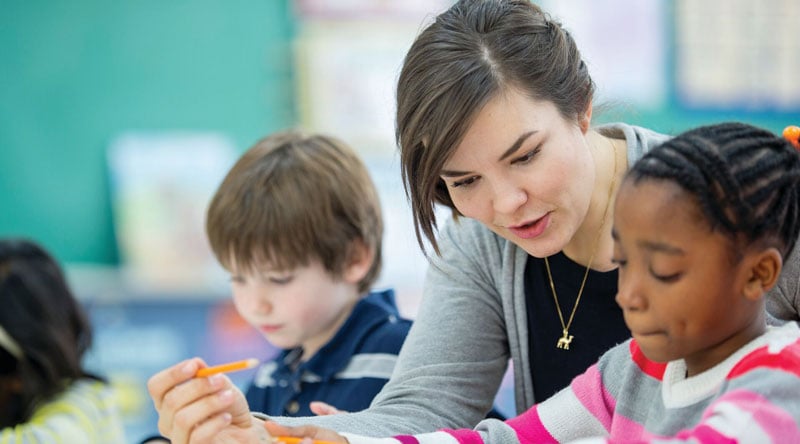 Education professional with students